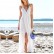 New white V-neck, low-cut, bifurcated hem, cross-strap dress on the back
