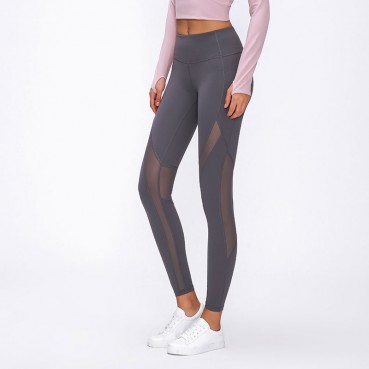 Spring and summer new stitching mesh grinding yoga pants high waist hip quick dry breathable sports nine pants female Europe