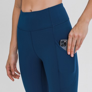2021 Europe and the United States new side of the sidewall pocket naked yoga pants female high waist arm force slim sports nine pants autumn and winter