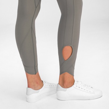 2021 Europe and the United States new solid color stitching high waist yoga pants female foot hollow cross small foot sports nine pants